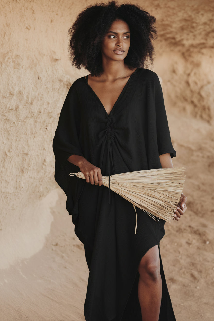 The Limited Edition Virgo Kaftan in off white, handmade in Bali by Myrah Penaloza, worn for a quiet evening of reflection