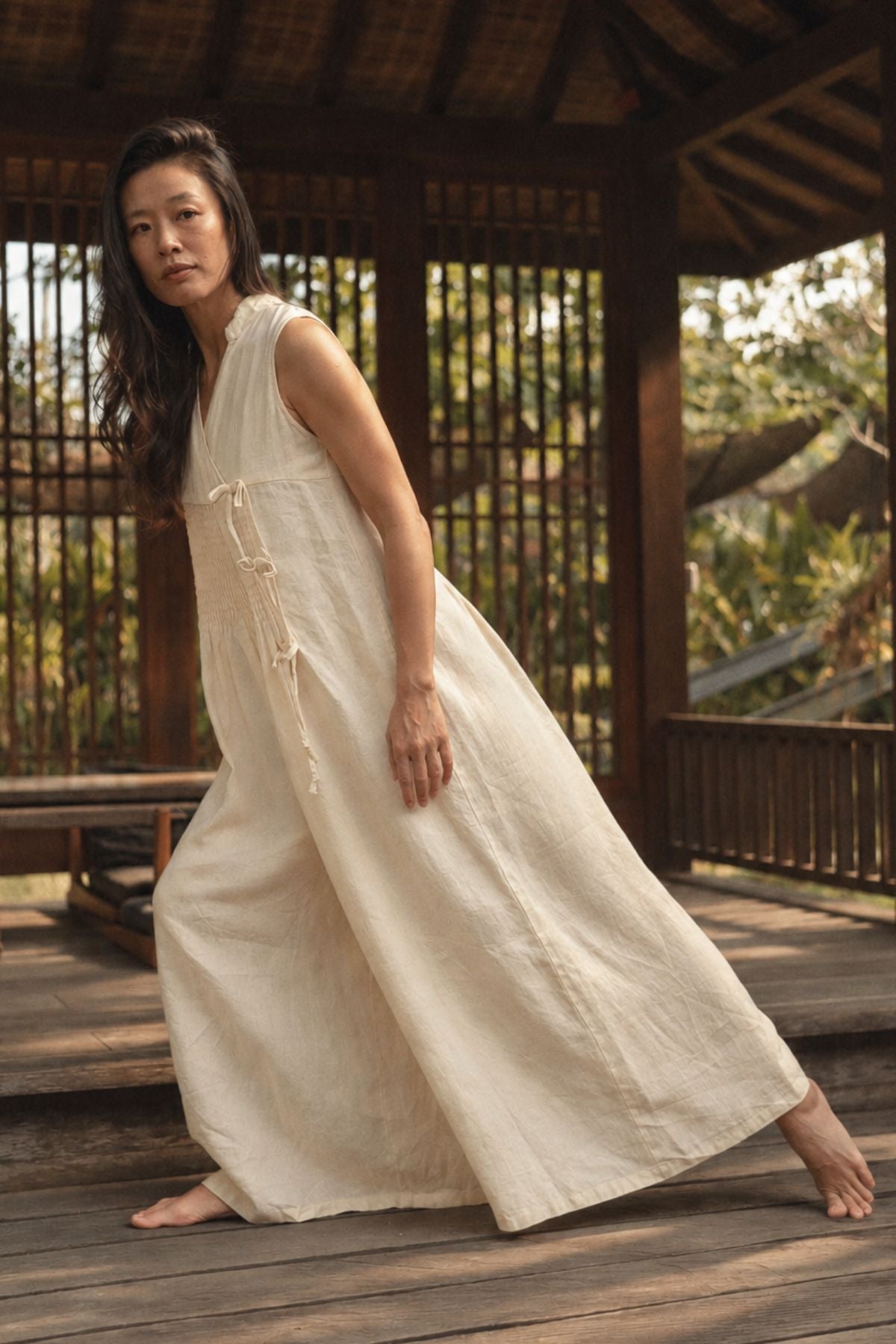 The Oracle Playsuit by Myrah Penaloza, a wide leg playsuit in Moon Milk stone washed linen from the Oracle Collection, hand stitched in Bali