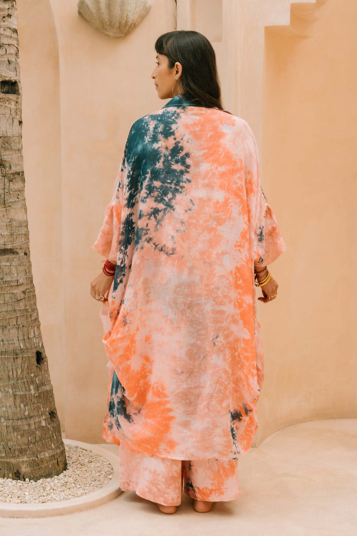 Ramie Origami Gown back view by Myrah Penaloza. Origami-inspired sleeve detail, natural ramie botanical dye, small batch.