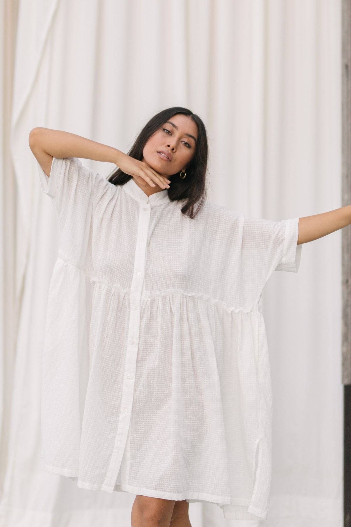 Back view of the Bona Dress Short Cotton by Myrah Penaloza in cotton, handcrafted in Bali by artisan families.