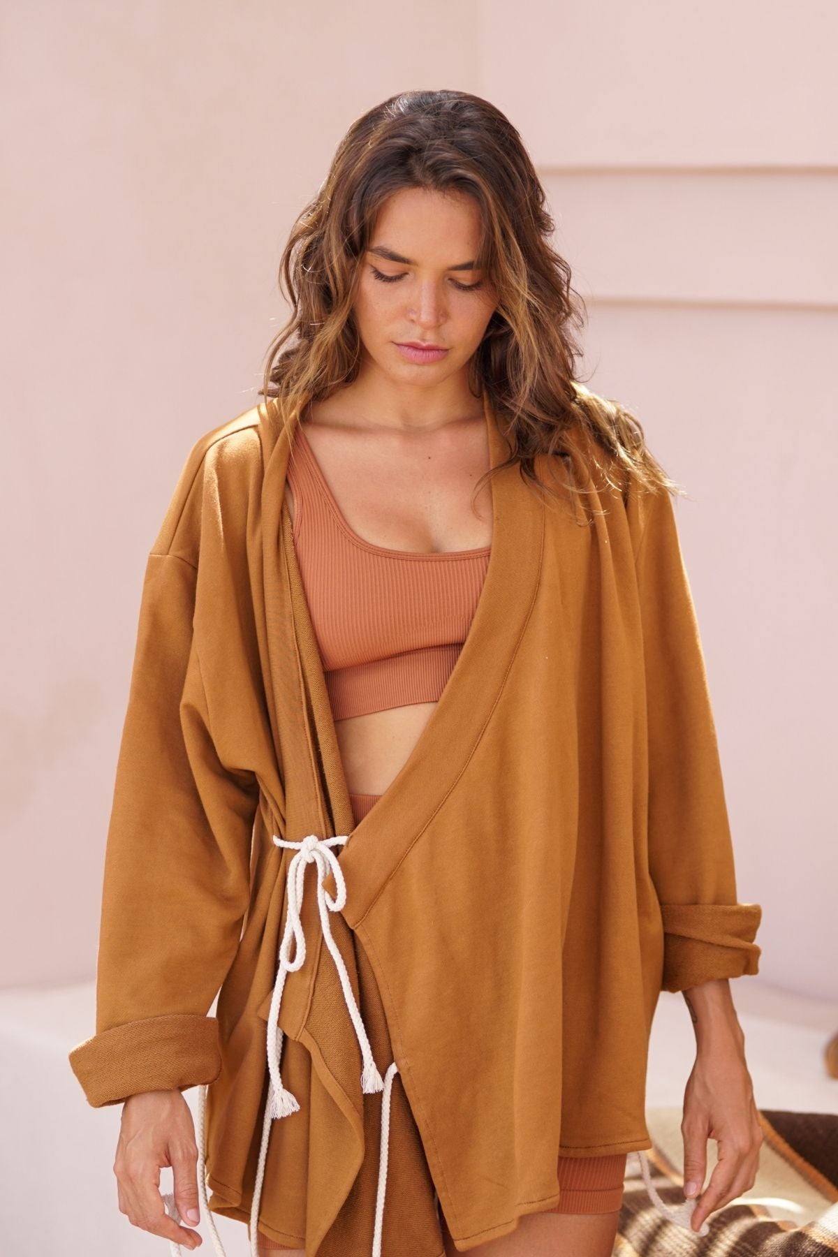 Side view of the Chai Ba Cotton Wrap Jacket by Myrah Penaloza in cotton, handcrafted in Bali by artisan families.