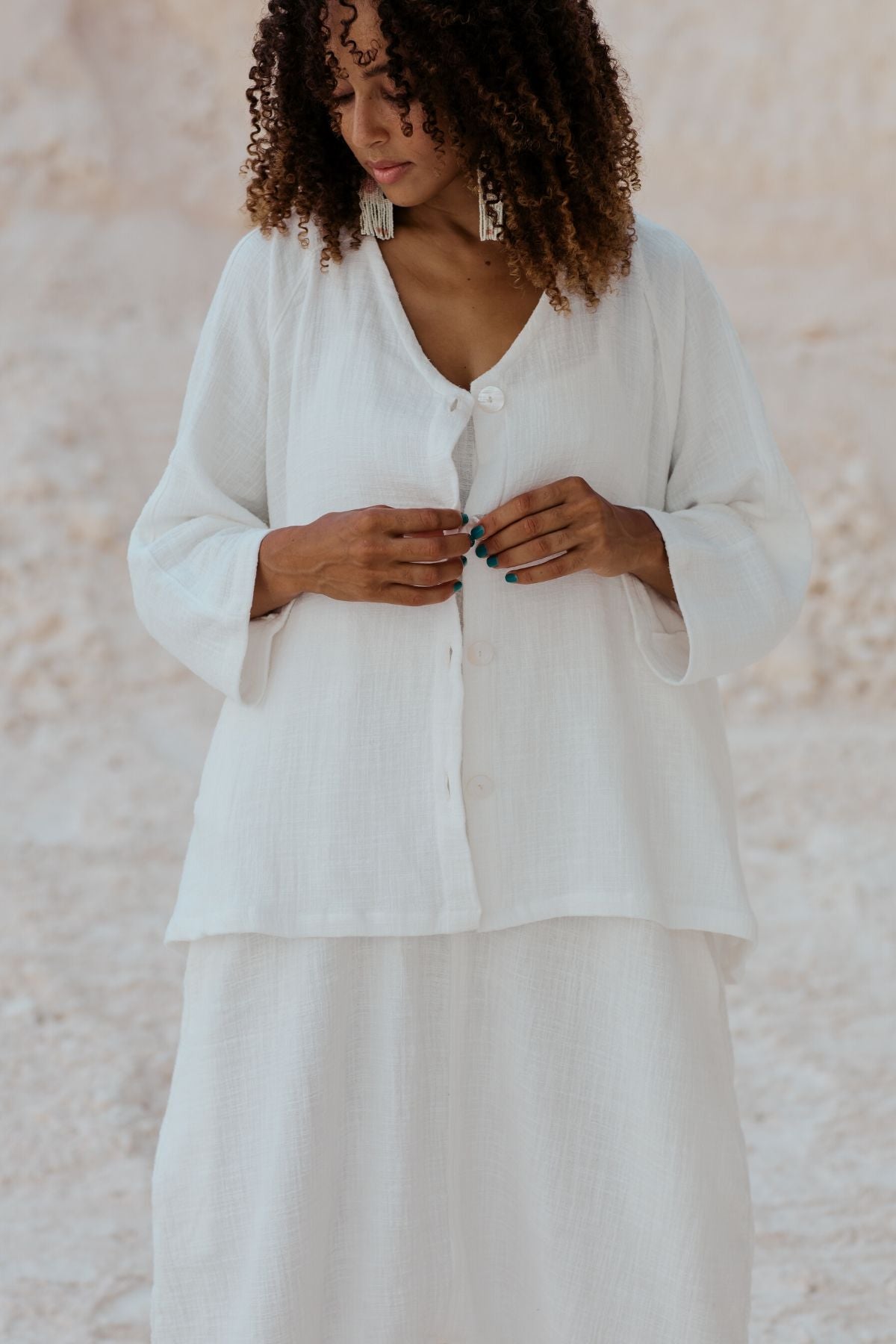 Close fabric detail of the White Golden Chain Jacket by Myrah Penaloza, handcrafted in Bali by artisan families.