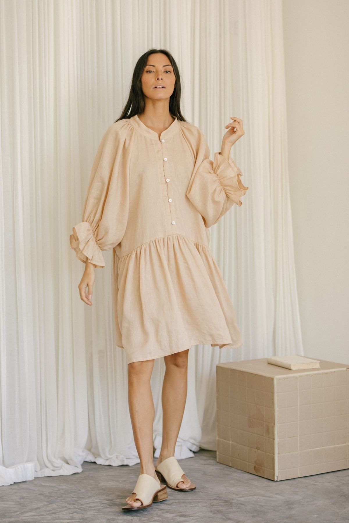 Side view of the Yema Dress Linen, Clay by Myrah Penaloza in linen, handcrafted in Bali by artisan families.