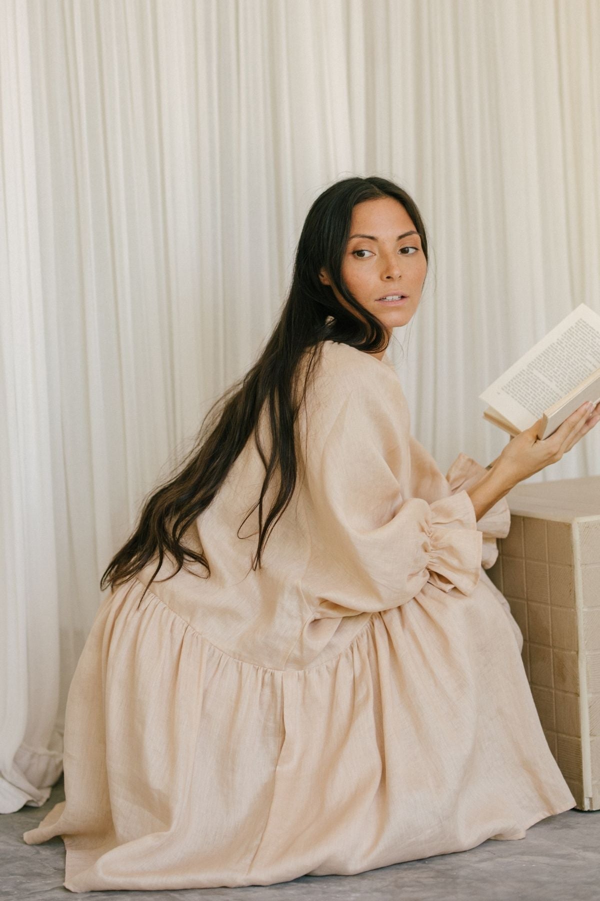Full-length view of the Yema Dress Linen, Clay by Myrah Penaloza in linen, handcrafted in Bali by artisan families.