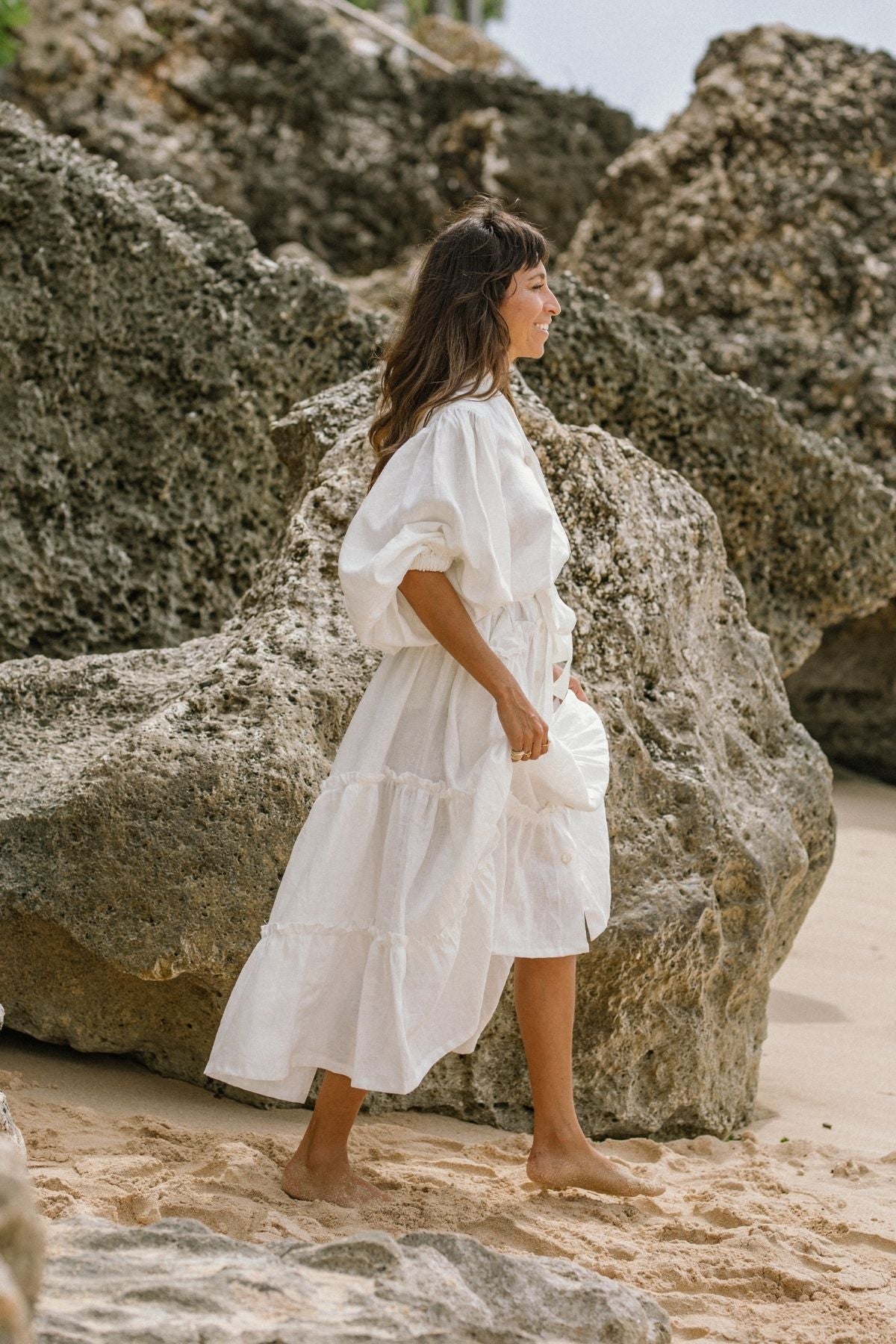 Detail of the hem of the La Dama with collar by Myrah Penaloza in linen, handcrafted in Bali by artisan families.