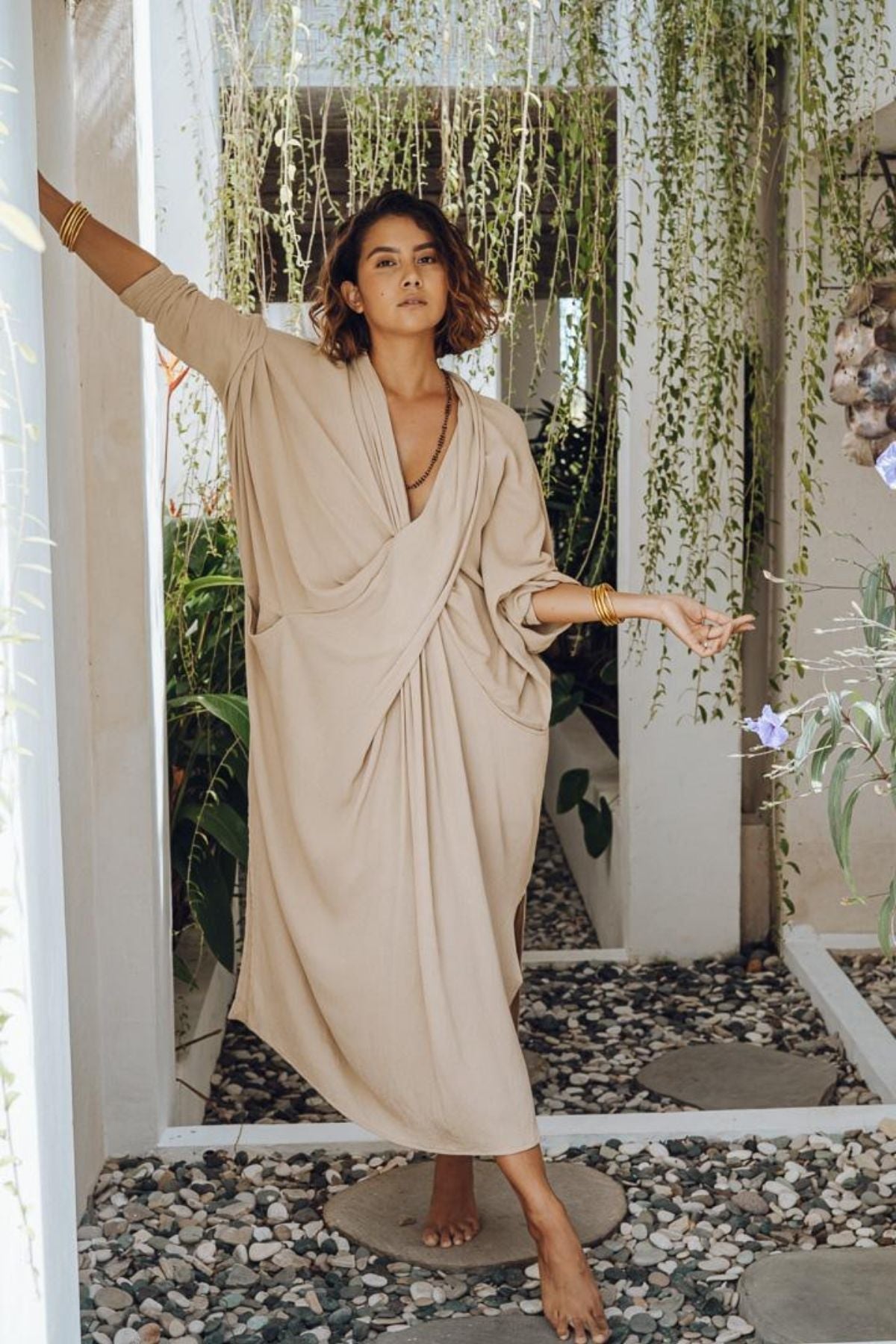 Amma Gown Spring Clay worn in Bali by Myrah Penaloza. Criss-cross front bamboo rayon gown, limited edition conscious fashion.