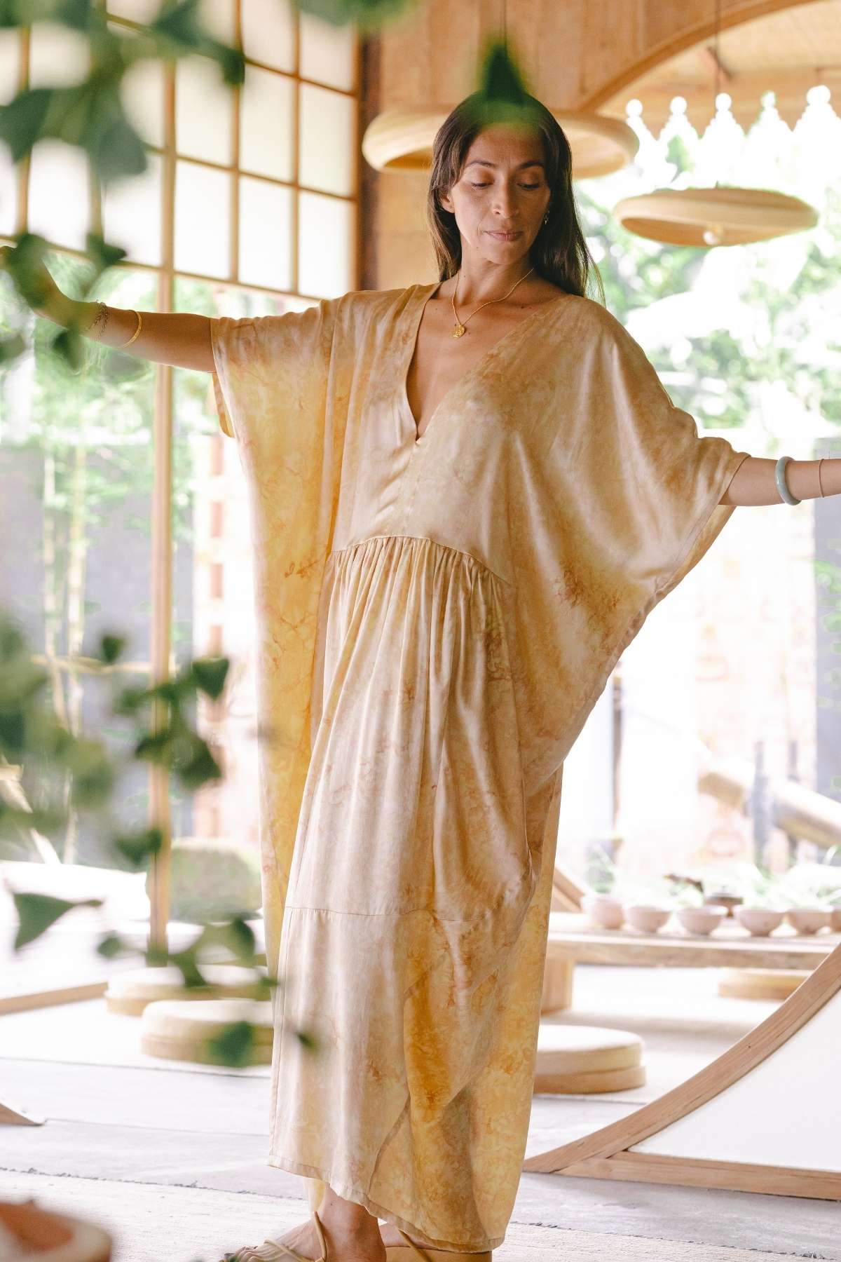 Full-length silk gown with low V neckline and side pockets, botanical rose dye, slow fashion Bali