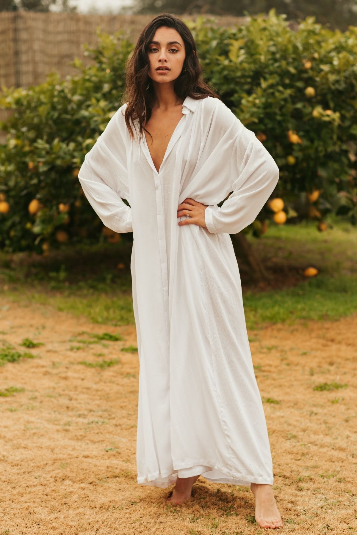 Back view of the Kundalini Gown by Myrah Penaloza — bamboo rayon full-length dress, flowing wide silhouette. Ethically handcrafted in Bali by artisan families. Made for ceremony and sacred living.