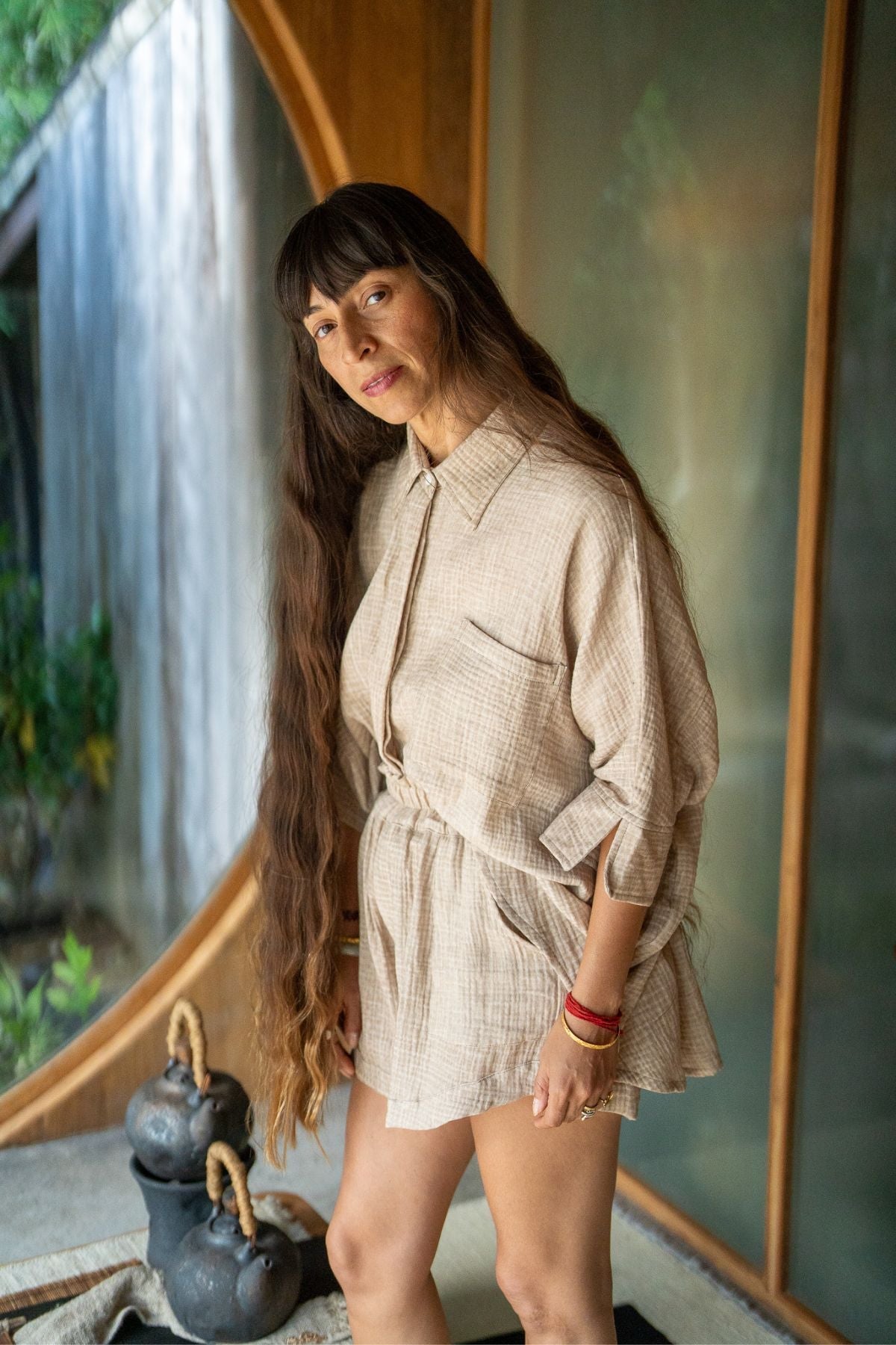 Mayra Penaloza, founder of Myrah Penaloza, with her hair grown long in devotion to her grandmother's memory