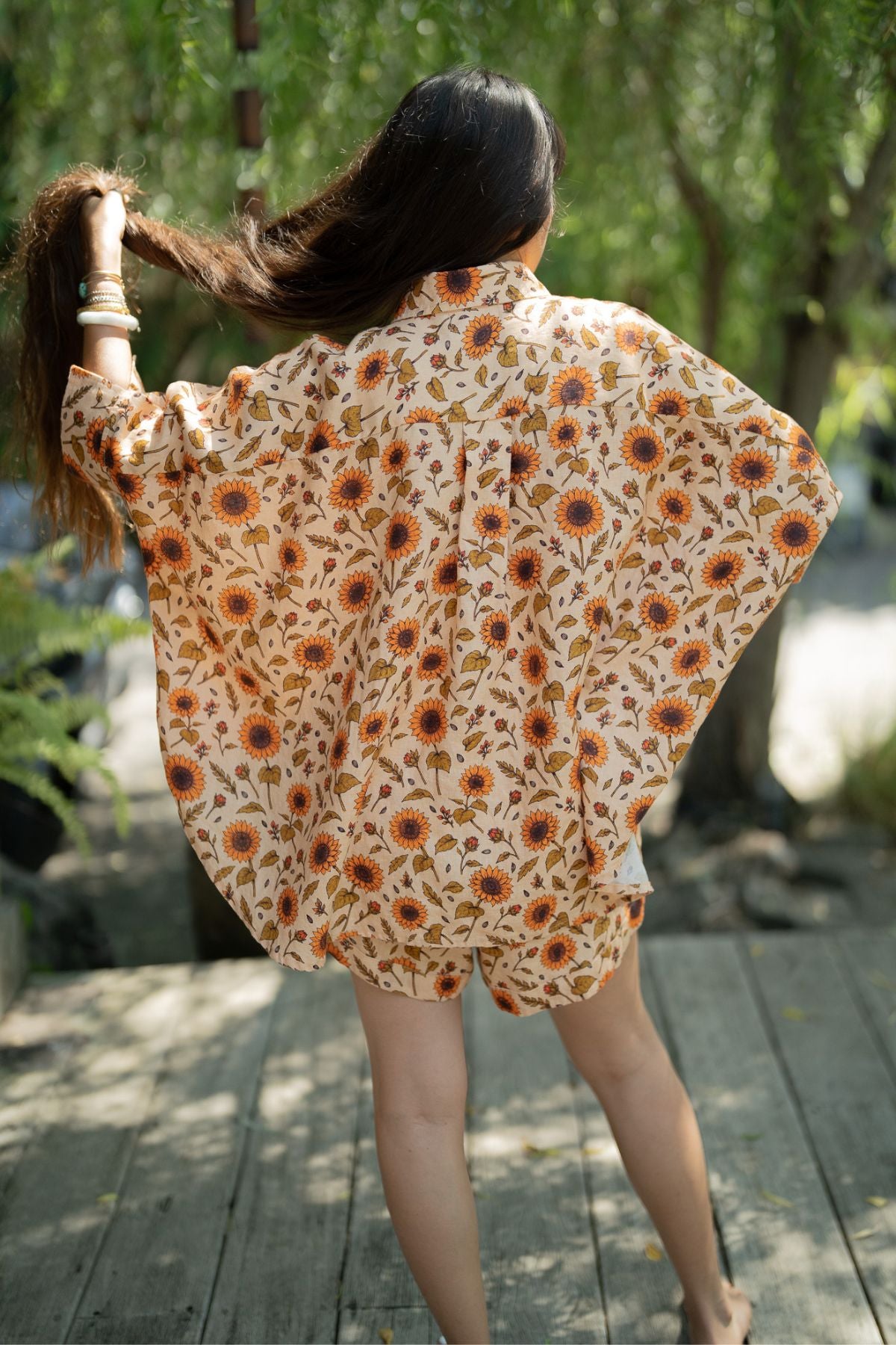 Back view of the Sun Offering Suka Set, the wide sunflower linen top falling over matching shorts