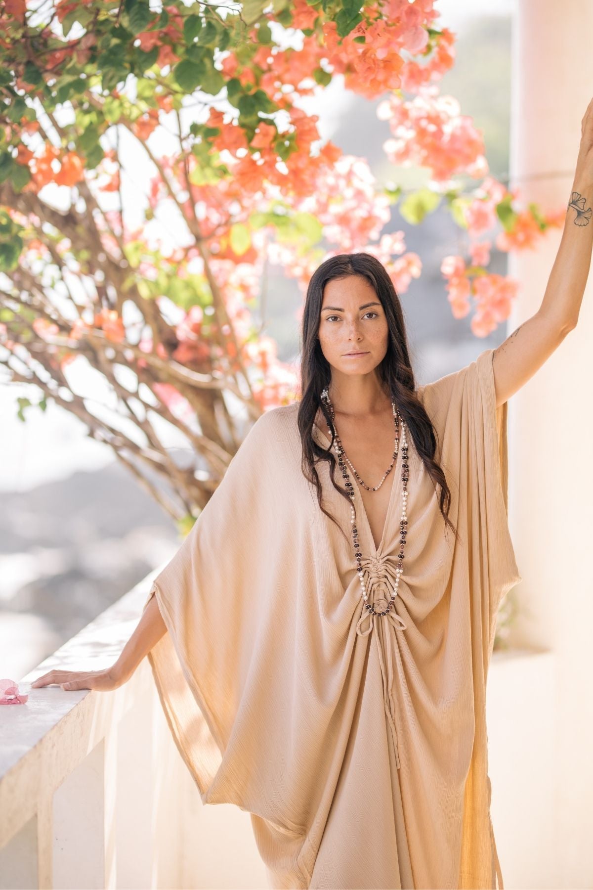 Limited Edition Virgo Kaftan in Clay colorway by Myrah Penaloza. 100% bamboo rayon, front cinch detail, small batch handcrafted in Bali.