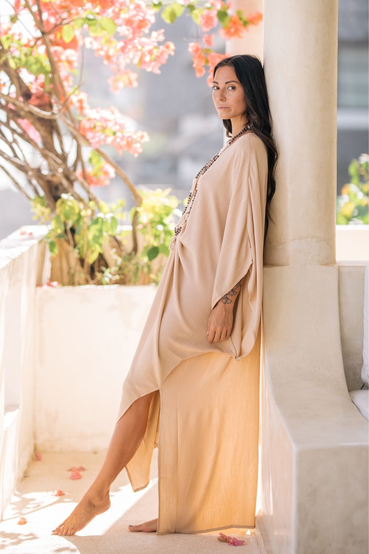 Limited Edition Virgo Kaftan in Black by Myrah Penaloza. 100% bamboo rayon, flowing silhouette, front cinch detail. Small batch, handmade in Bali.
