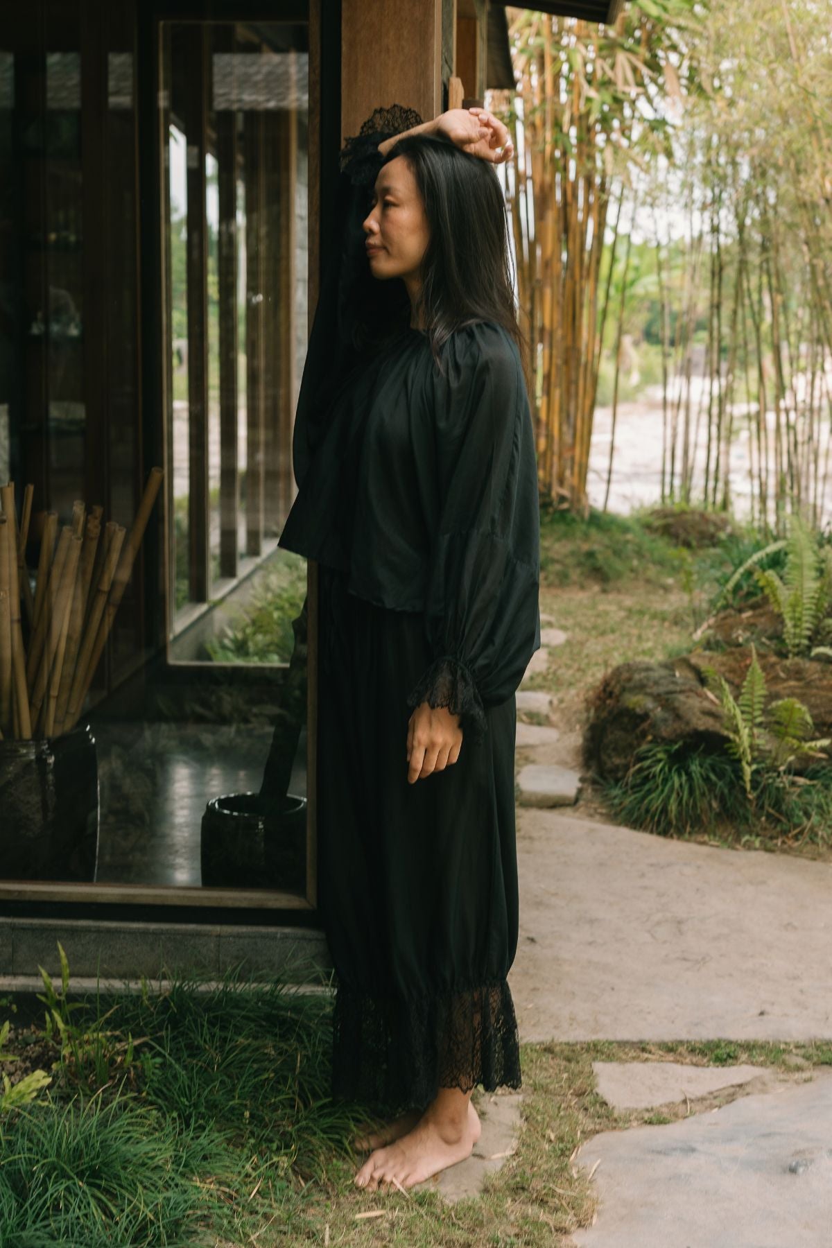 Side profile in the Anusara Evening Set, Dark Moon Black silk and cotton top and pant, handcrafted in Bali.
