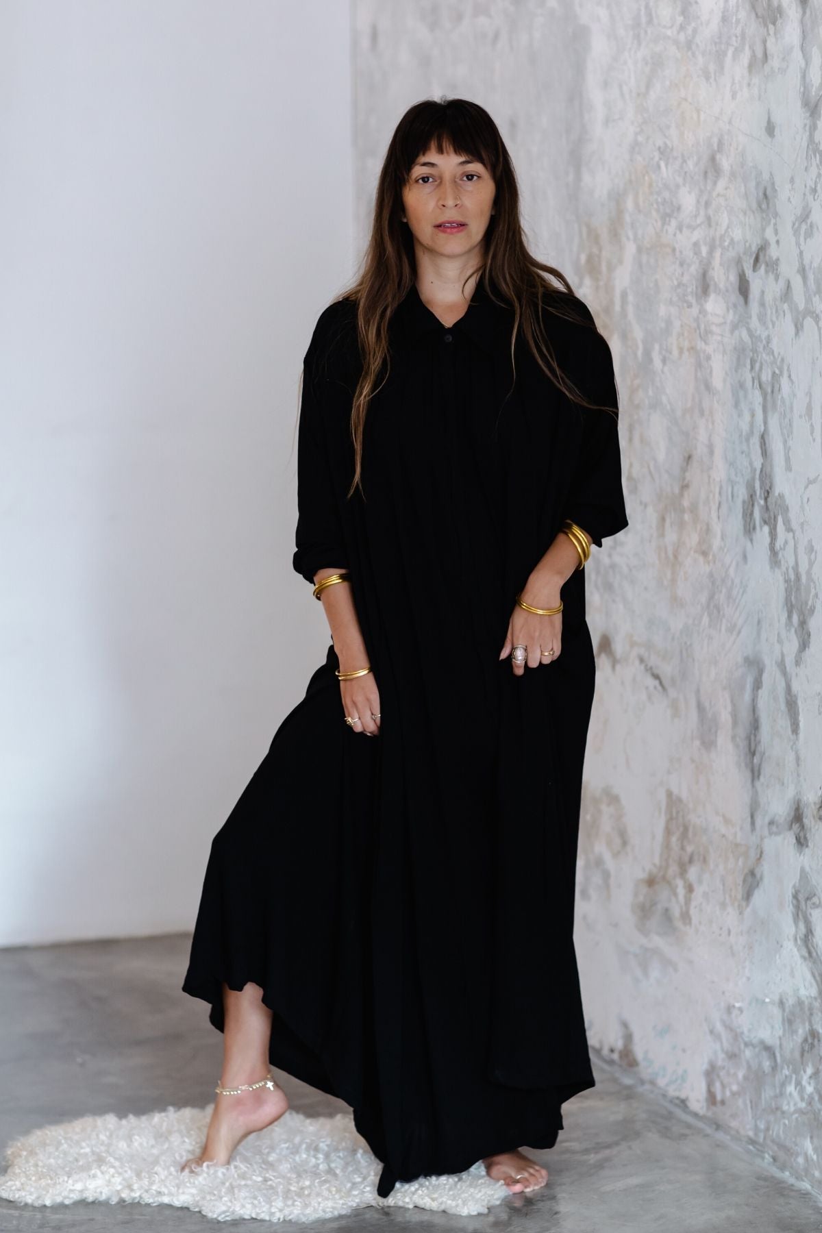 Woman in movement wearing the Kundalini Gown by Myrah Penaloza — flowing bamboo rayon maxi dress for Kundalini yoga, meditation, and ceremony. Sacred feminine clothing made by hand in Bali.