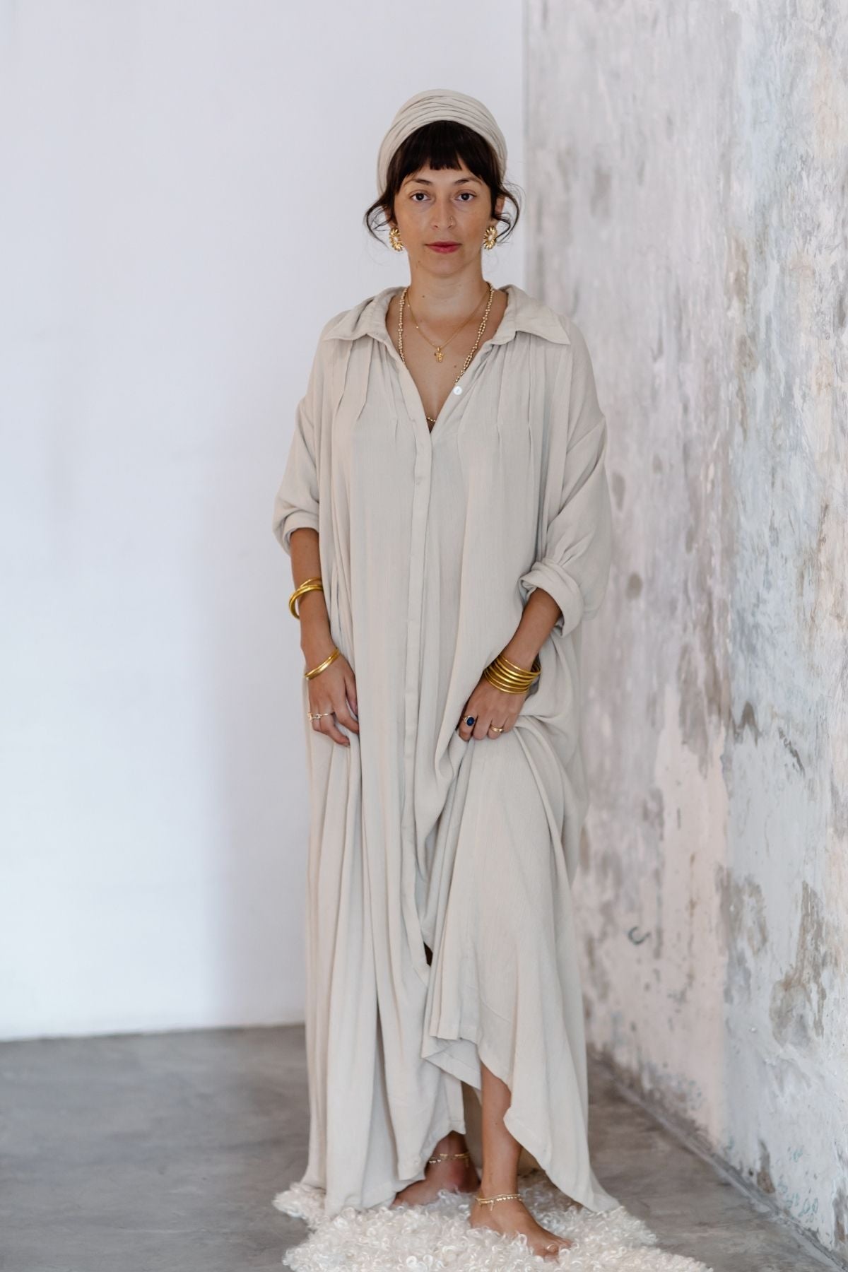 Side view of the Kundalini Gown by Myrah Penaloza — 100% bamboo rayon maxi dress with wide sleeves and flowing length. Sacred feminine fashion handcrafted in Bali, conscious slow made clothing.