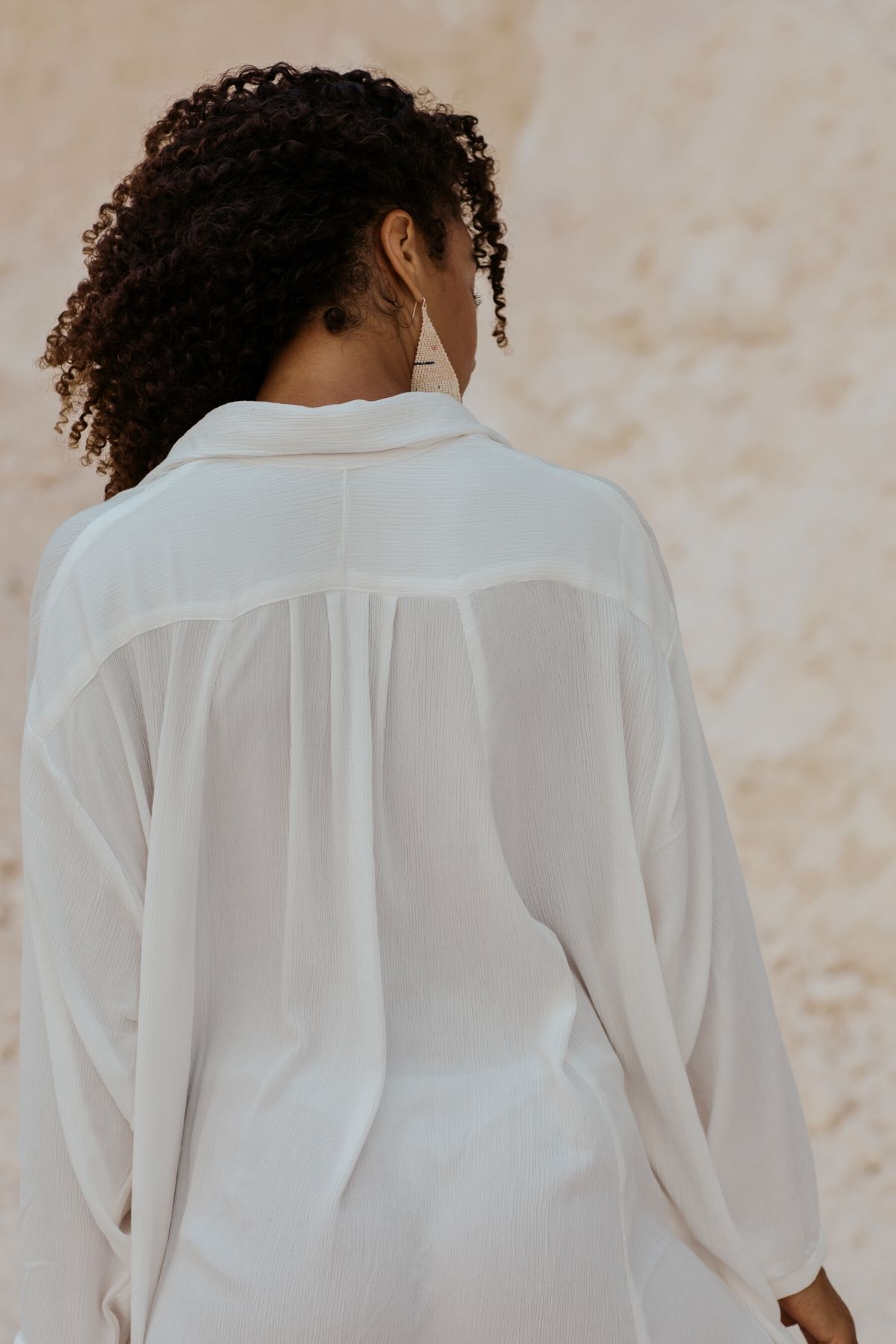 Studio view of the Kundalini Gown by Myrah Penaloza, handcrafted in Bali by artisan families.